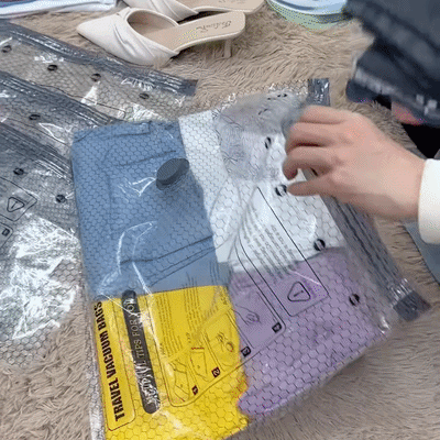 Traveler compressing clothing with a portable vacuum pump